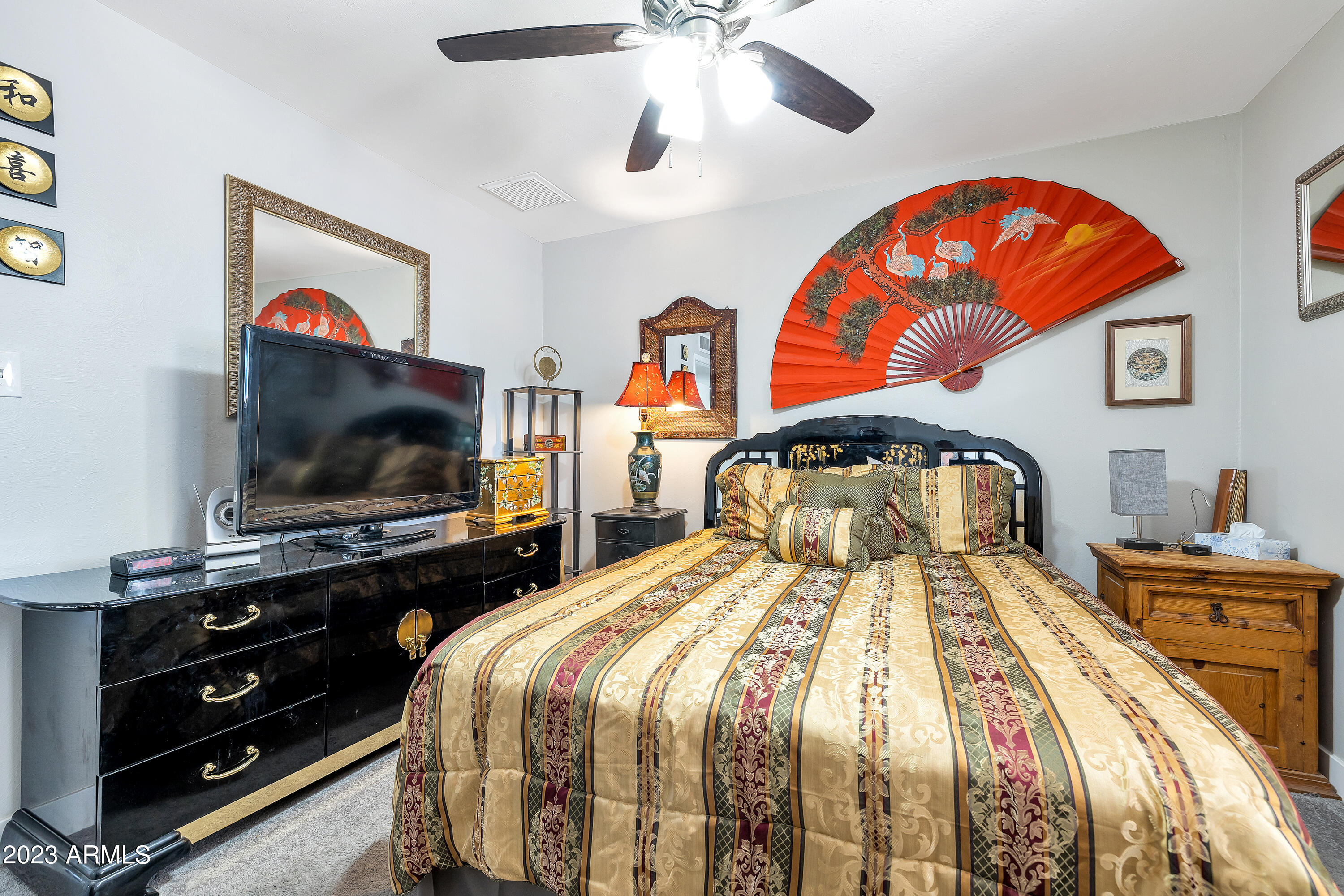 5473 West Osborn Road Phoenix, AZ 85031 - Photo 31 of 37 a bedroom with 2 bed and a flat screen tv