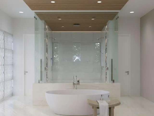 a bathroom with a bathtub and shower