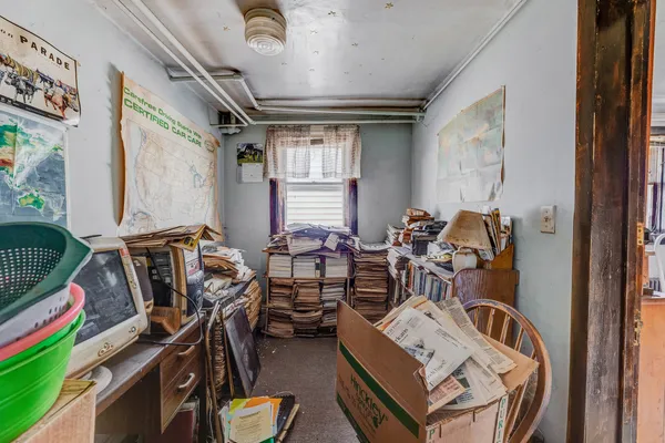a view of a livingroom with furniture and a window
