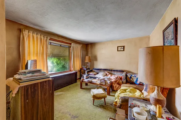 a bedroom with furniture and a window