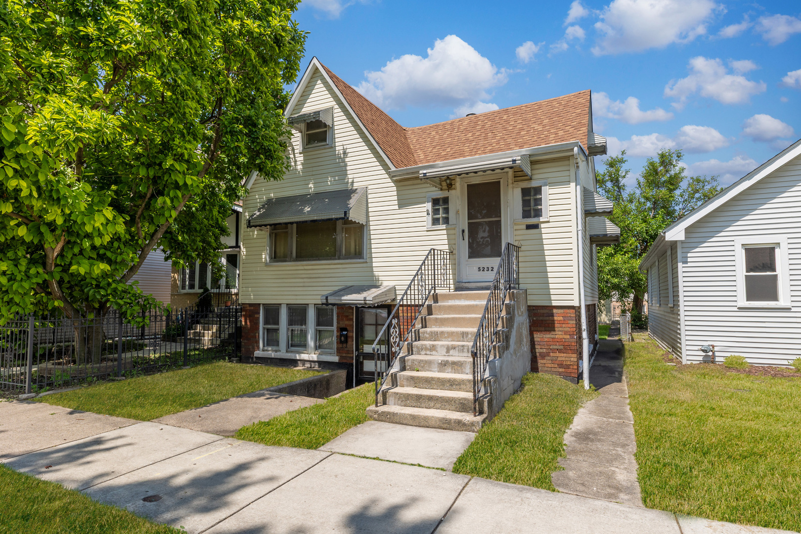 5232 West 51st Street Chicago, IL 60638 - Photo 24 of 28 a front view of a house with a yard
