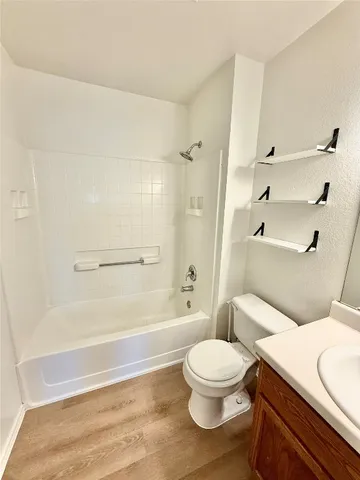 a bathroom with a toilet a sink and a bathtub