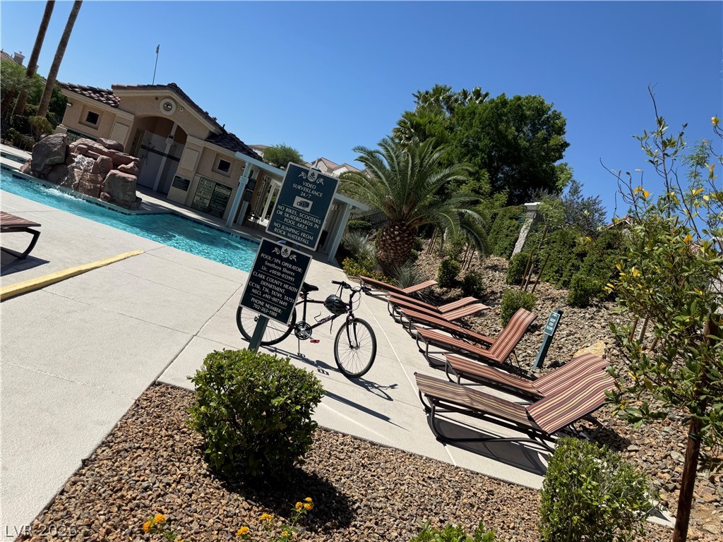 1141 Cathedral Ridge Street Henderson, NV 89052 - Photo 76 of 77 Relax poolside at this tranquil community oasis, perfect for enjoying sunny days.