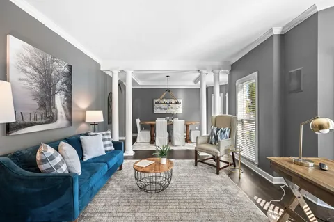 a living room with fireplace furniture and a flat screen tv