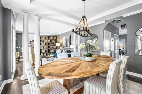 a kitchen with stainless steel appliances kitchen island granite countertop a sink stove and refrigerator