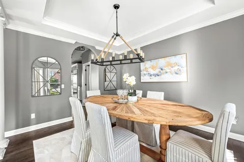 a kitchen with granite countertop a sink and a stove