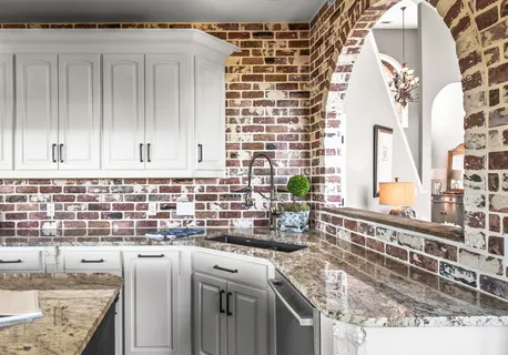 a view of a dining room with furniture wooden floor and a chandelier