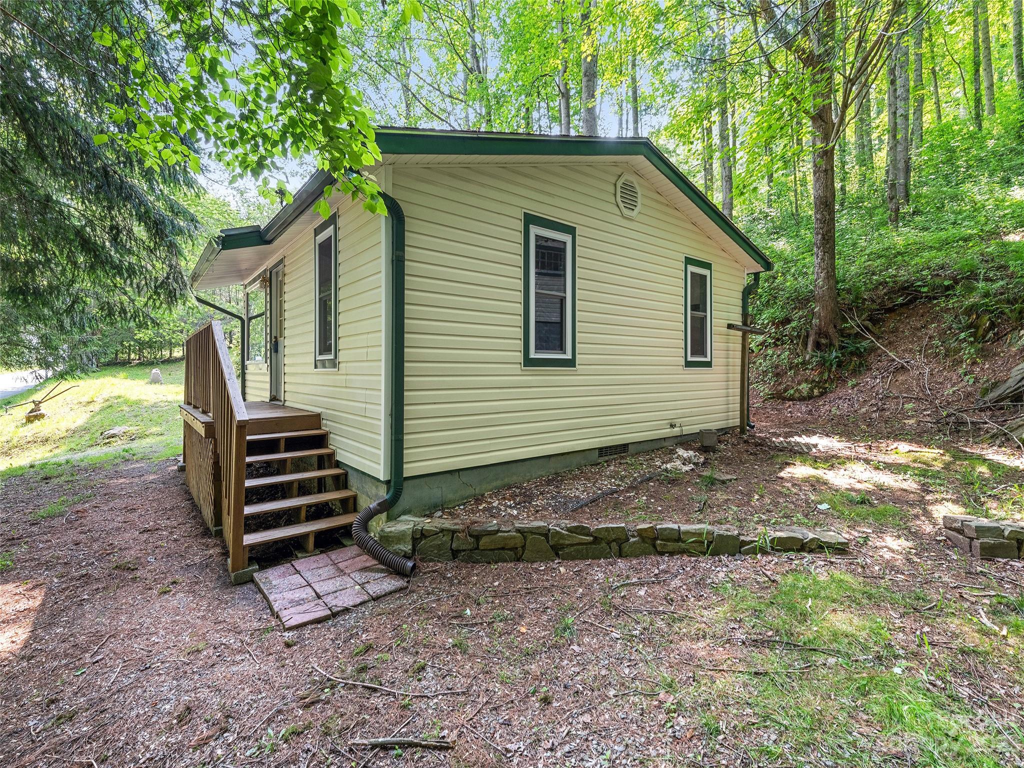 1053 Hall Top Road Waynesville, NC 28786 - Photo 4 of 27 a view of a house with a yard