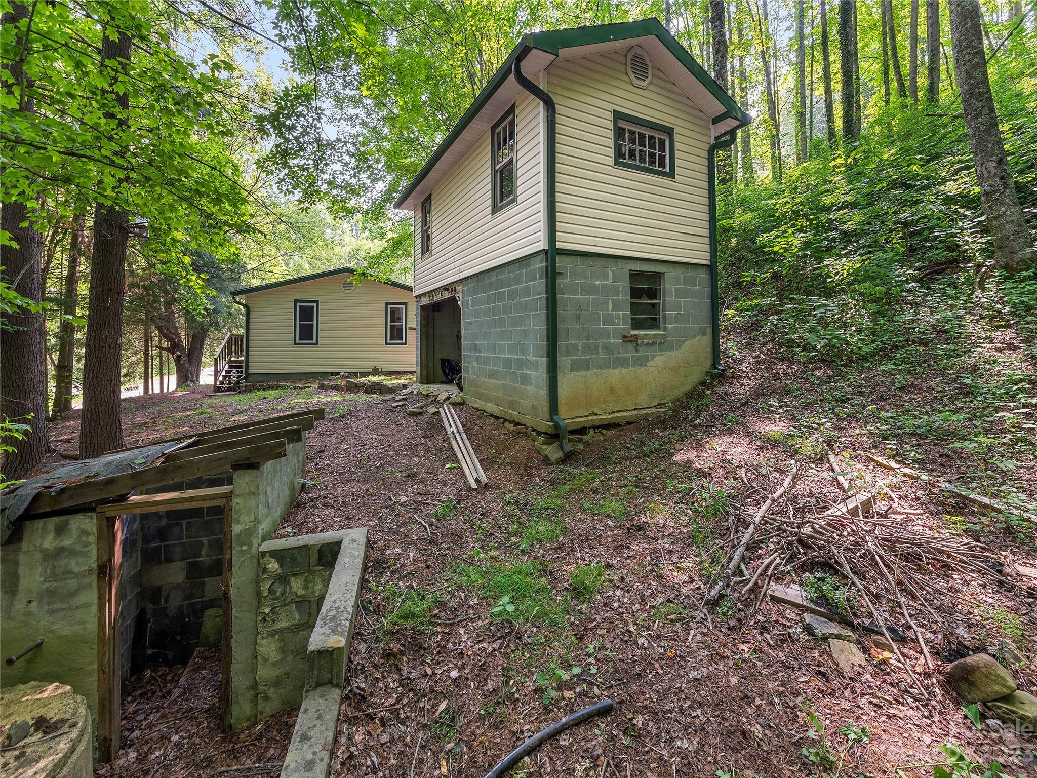 1053 Hall Top Road Waynesville, NC 28786 - Photo 5 of 27 a view of a house with backyard