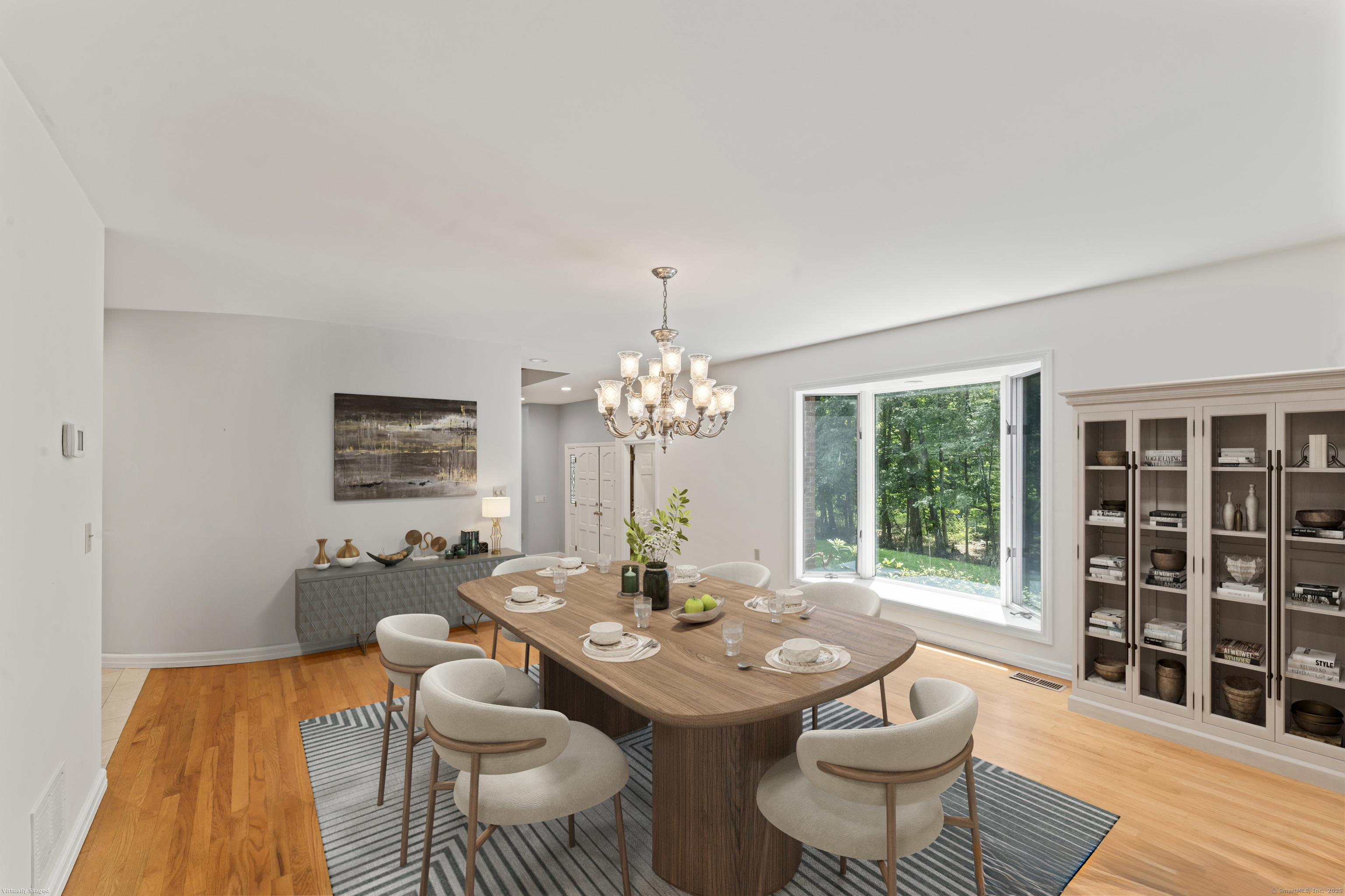 501 Woodbine Road Stamford, CT 06903 - Photo 13 of 37 a view of a dining room with furniture window and wooden floor