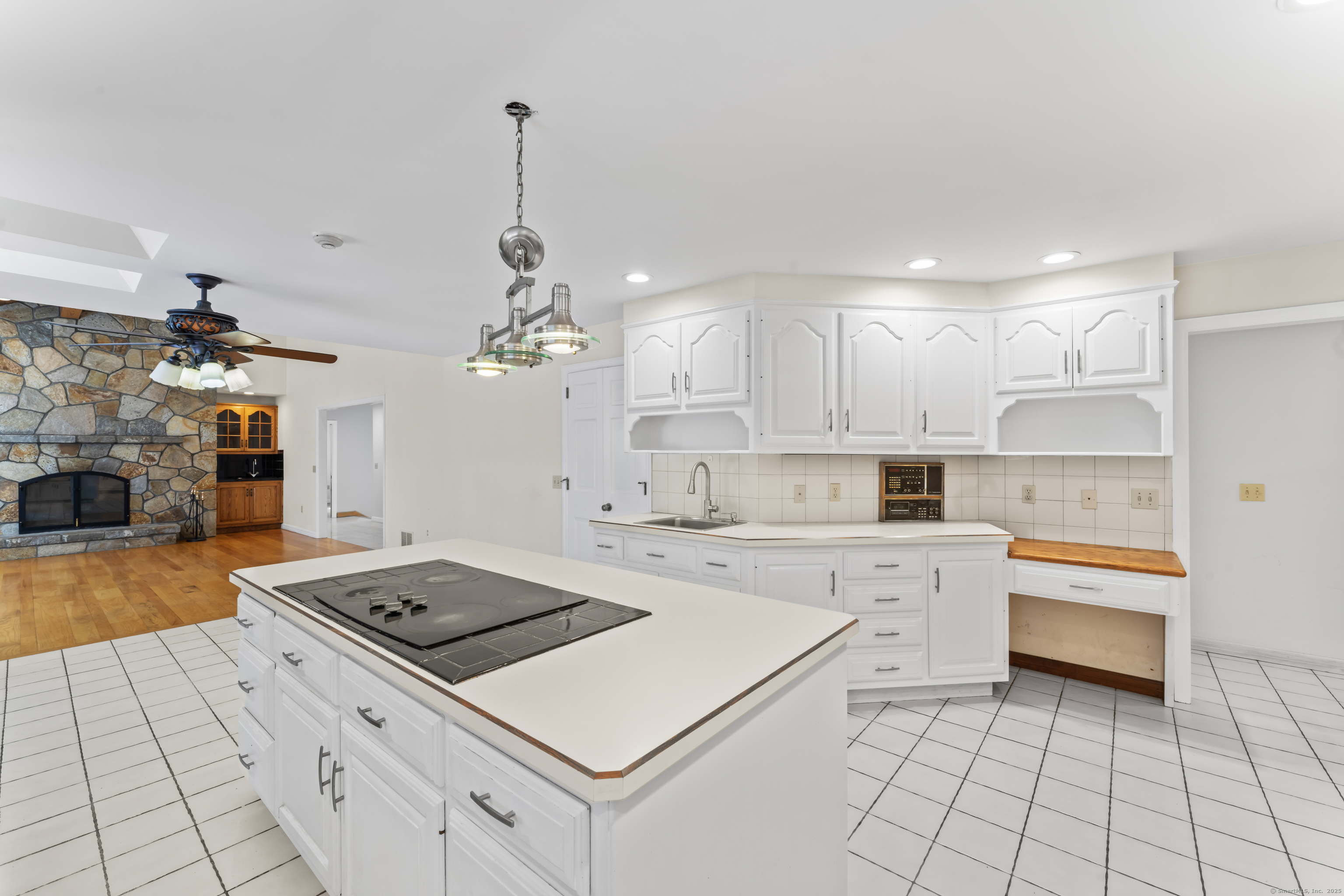 501 Woodbine Road Stamford, CT 06903 - Photo 15 of 37 a kitchen that has a stove a sink and a microwave