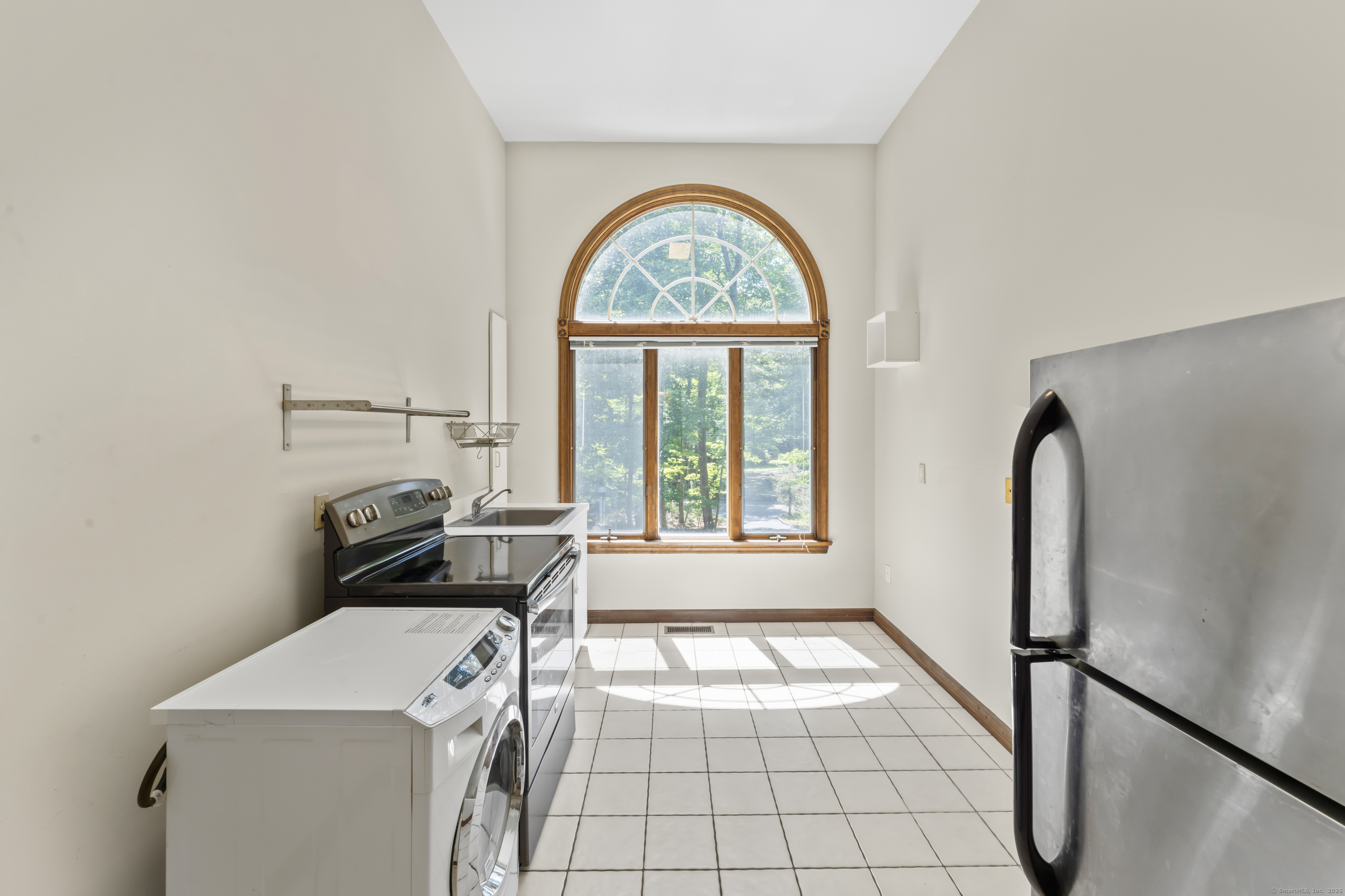 501 Woodbine Road Stamford, CT 06903 - Photo 21 of 37 a view of a livingroom with furniture and window