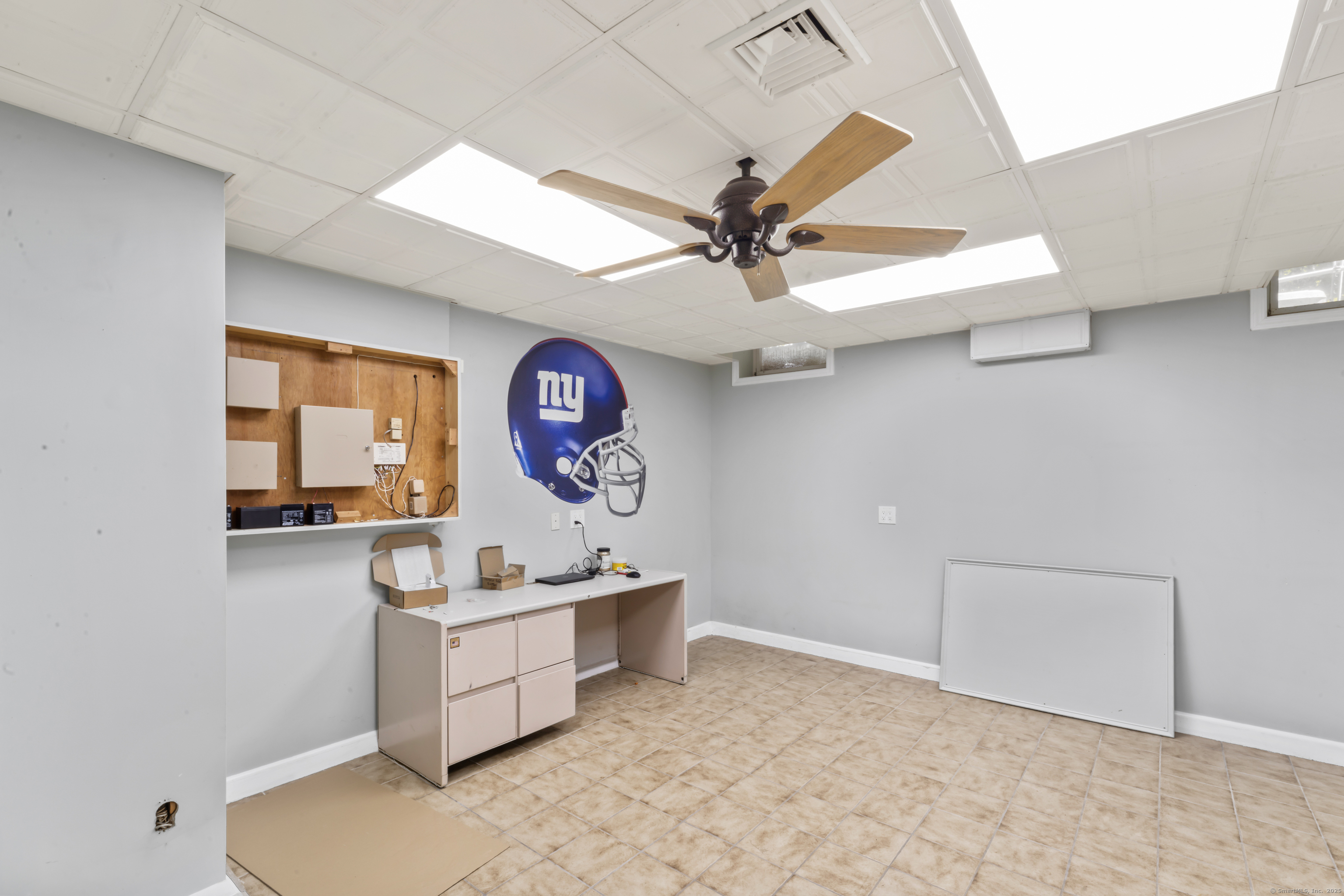 501 Woodbine Road Stamford, CT 06903 - Photo 23 of 37 a room with chandelier fan and windows