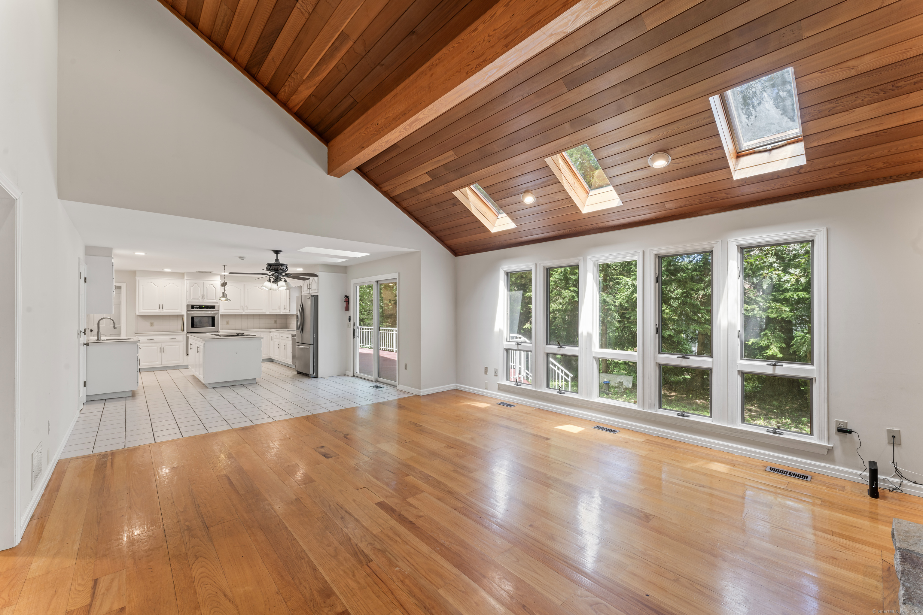 501 Woodbine Road Stamford, CT 06903 - Photo 24 of 37 a view of empty room with wooden floor and windows
