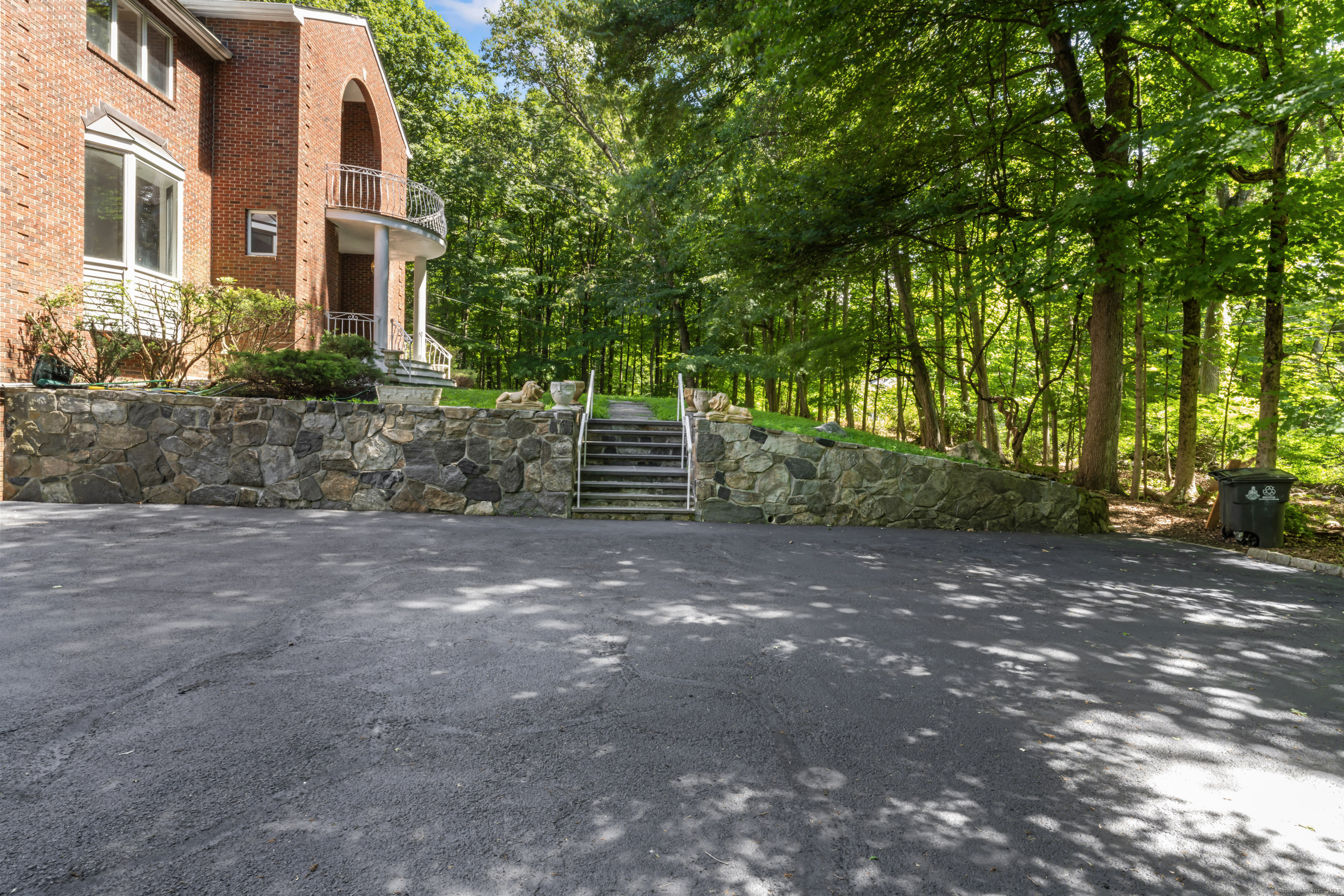 501 Woodbine Road Stamford, CT 06903 - Photo 6 of 37 a view of a house with a yard