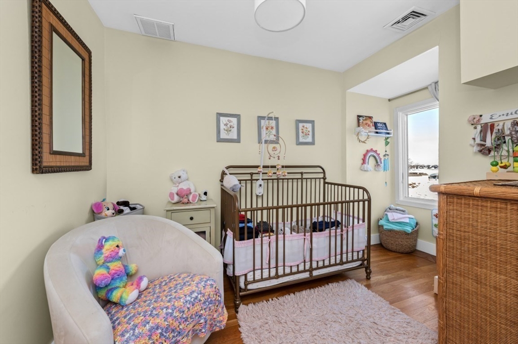 171 Coleridge Street Boston, MA 02128 - Photo 20 of 30 a bedroom with baby bed baby crib and a baby crib