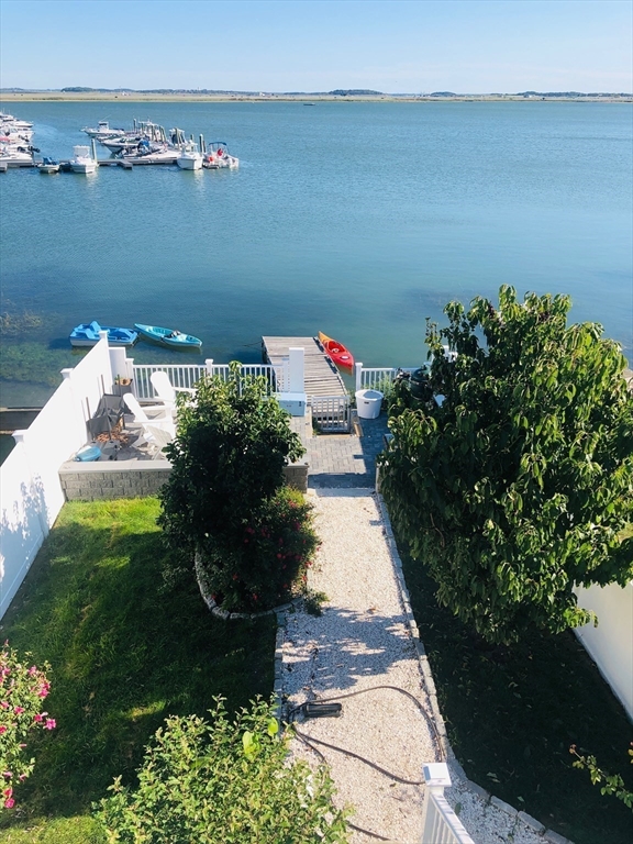 171 Coleridge Street Boston, MA 02128 - Photo 2 of 30 a view of a lake with a yard