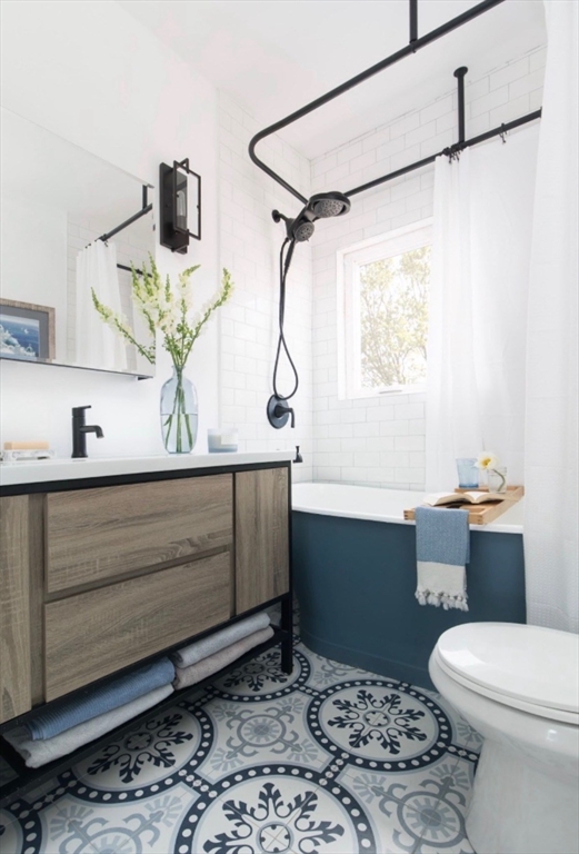 171 Coleridge Street Boston, MA 02128 - Photo 21 of 30 a bathroom with a sink toilet and shower