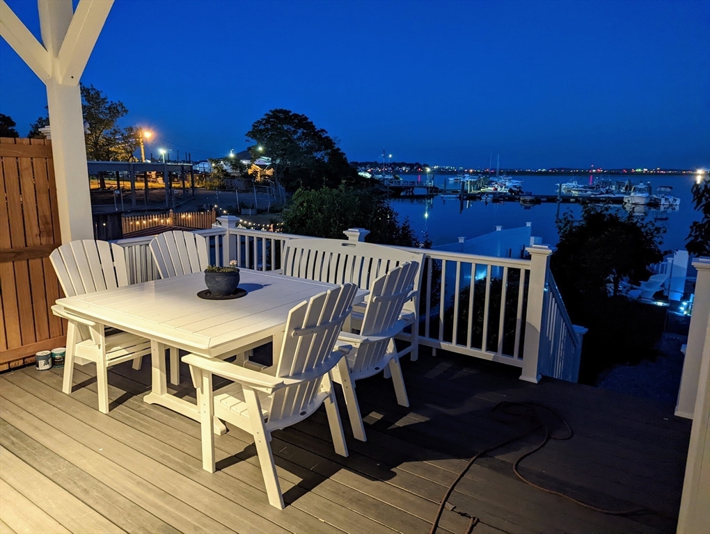 171 Coleridge Street Boston, MA 02128 - Photo 28 of 30 a view of a dinning tables and chairs in the patio