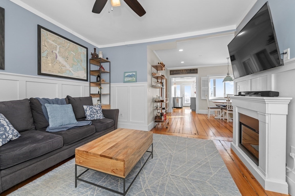 171 Coleridge Street Boston, MA 02128 - Photo 6 of 30 a living room with furniture and a fireplace