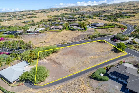 a view of a garden with an outdoor seating