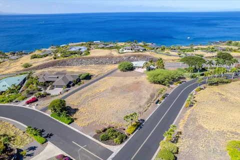 a front view of a house with a yard and a garage