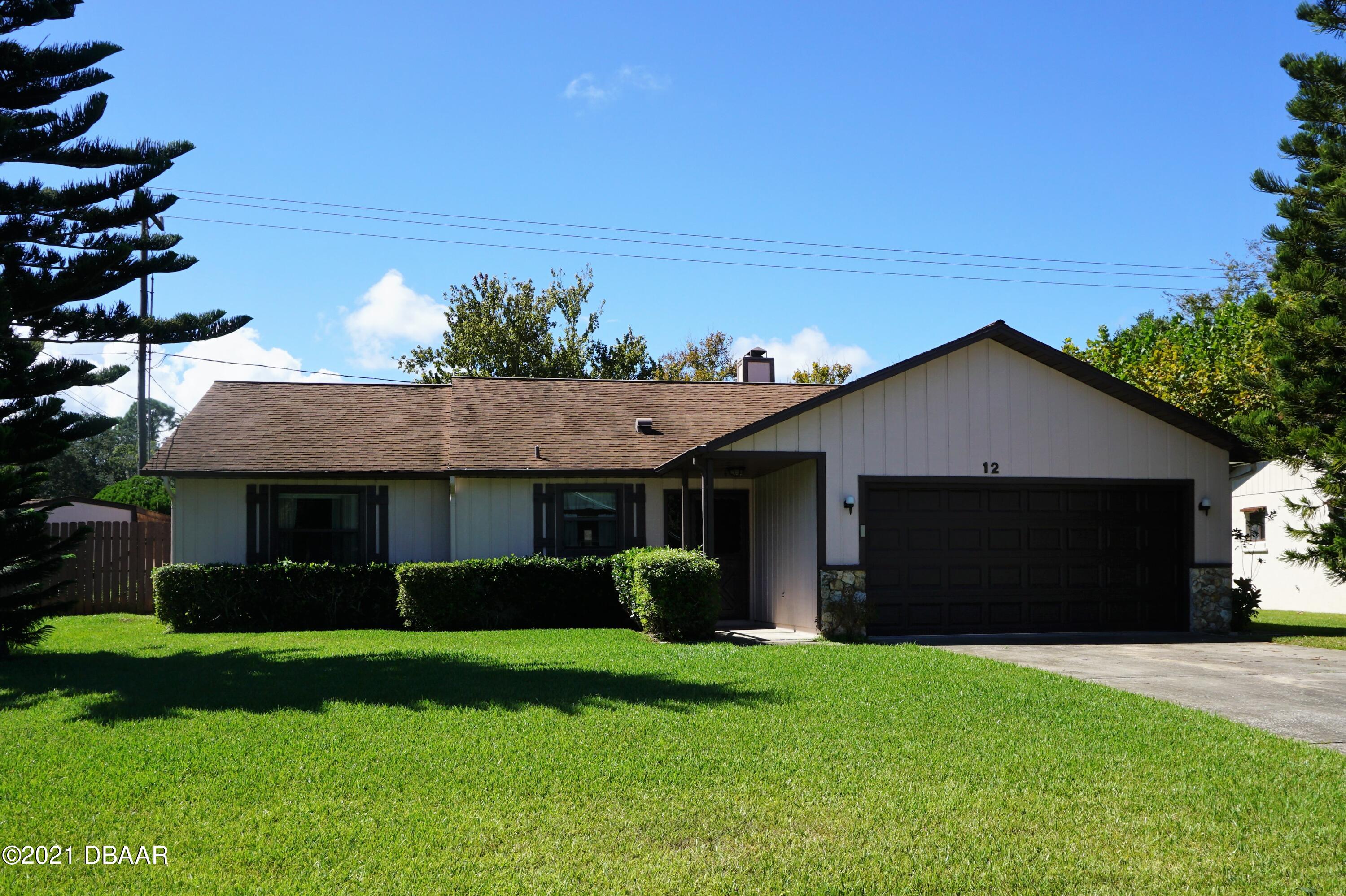 12 Charleston Square Ormond Beach, FL 32174 - Photo 1 of 26 a front view of house with yard and green space