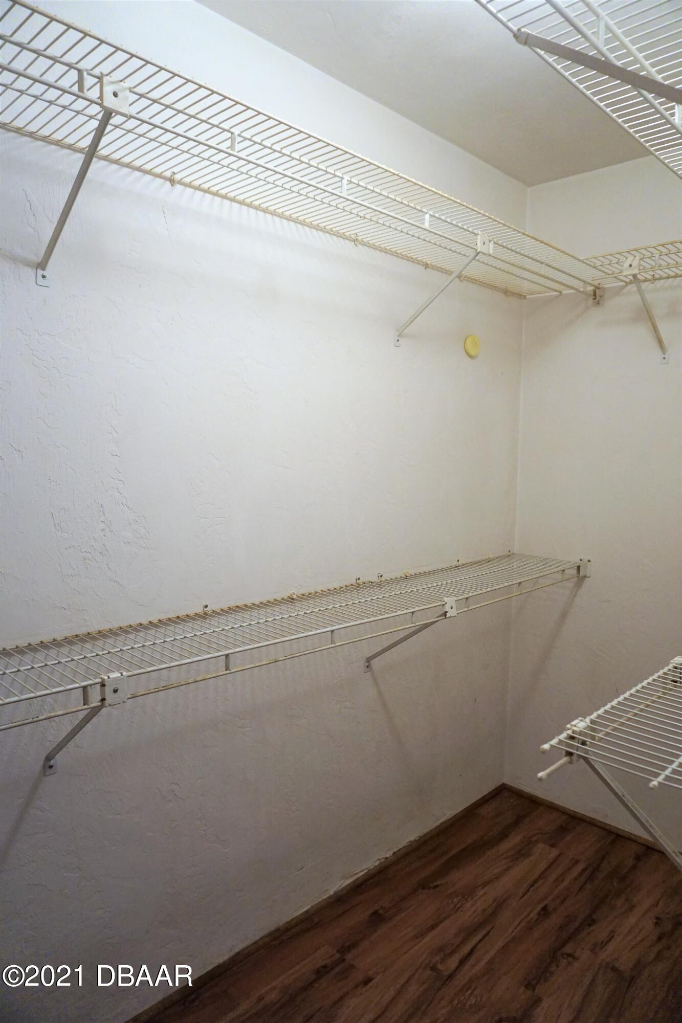 12 Charleston Square Ormond Beach, FL 32174 - Photo 12 of 26 a view of a room with racks on the wall