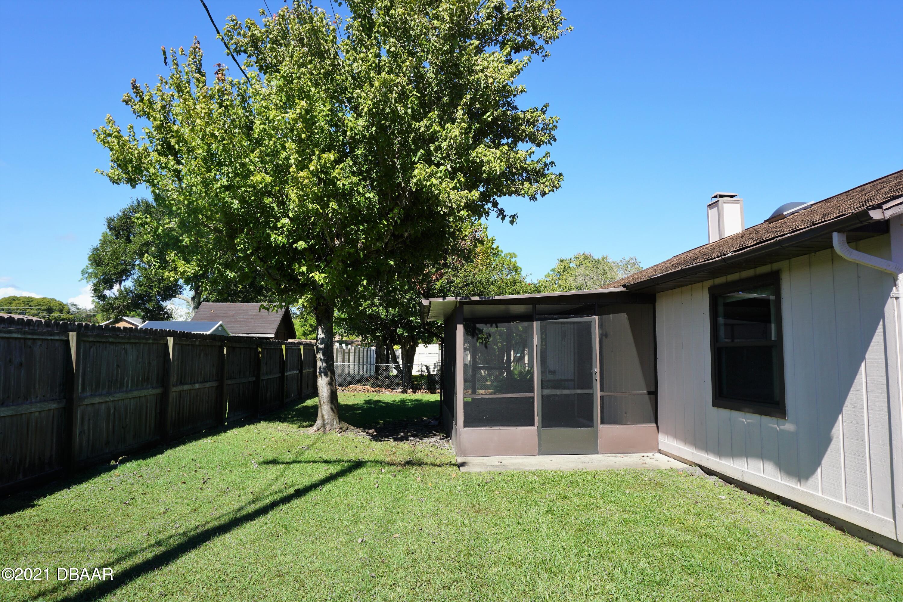 12 Charleston Square Ormond Beach, FL 32174 - Photo 23 of 26 a view of backyard with green space