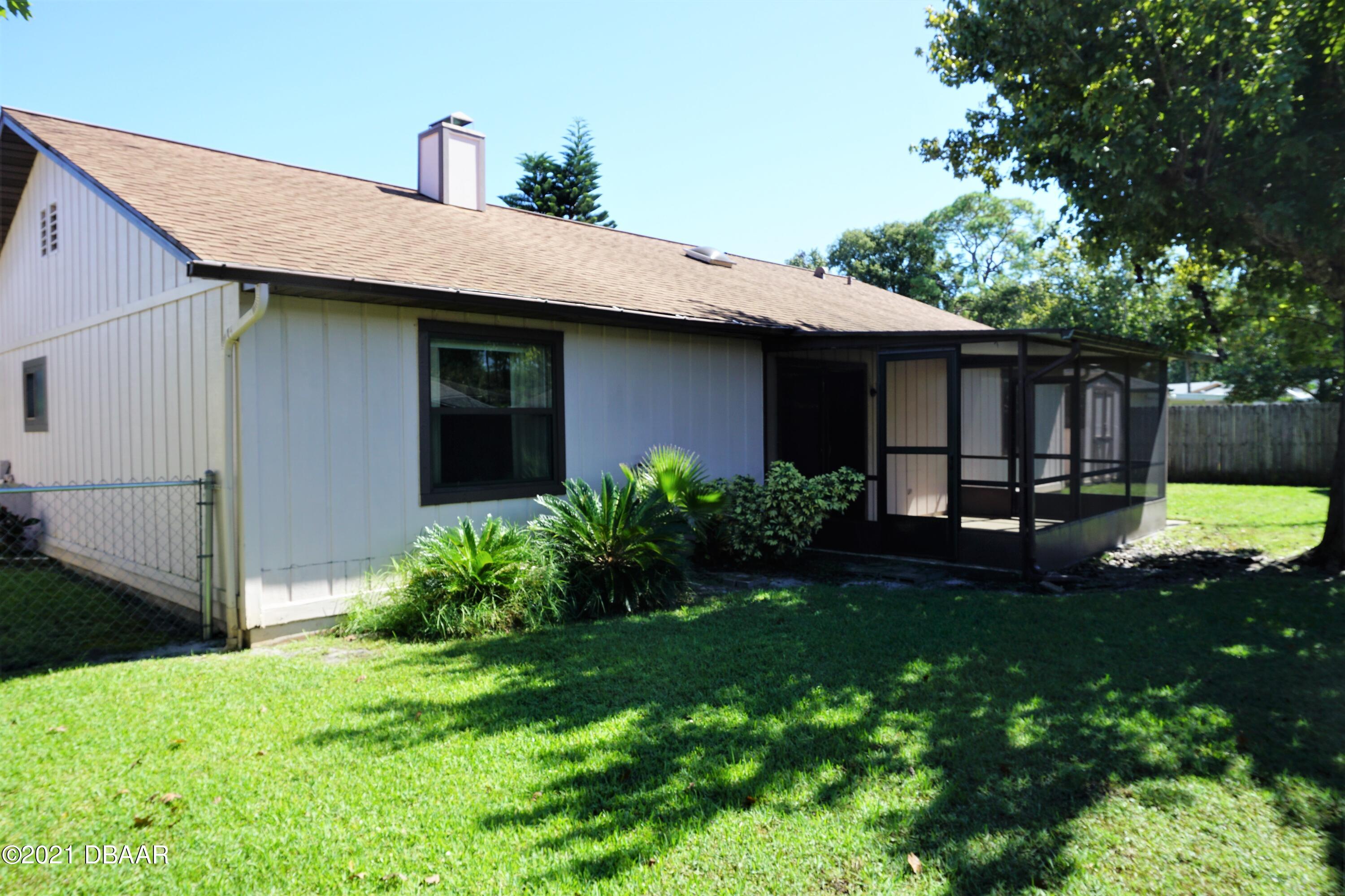 12 Charleston Square Ormond Beach, FL 32174 - Photo 25 of 26 a house view with a garden space