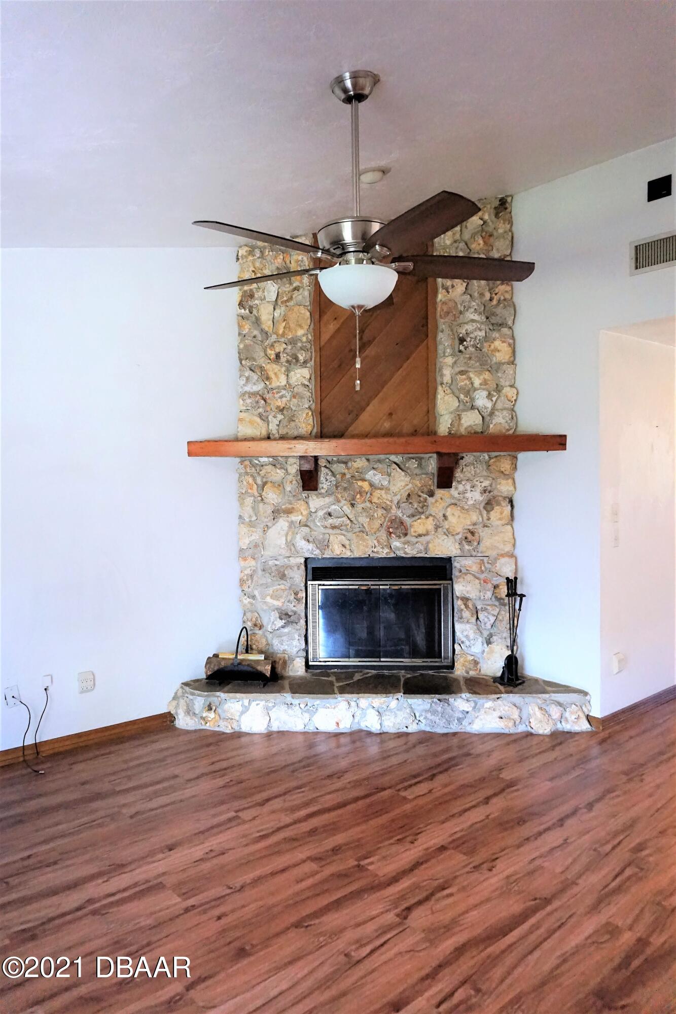 12 Charleston Square Ormond Beach, FL 32174 - Photo 4 of 26 a living room with wooden floor
