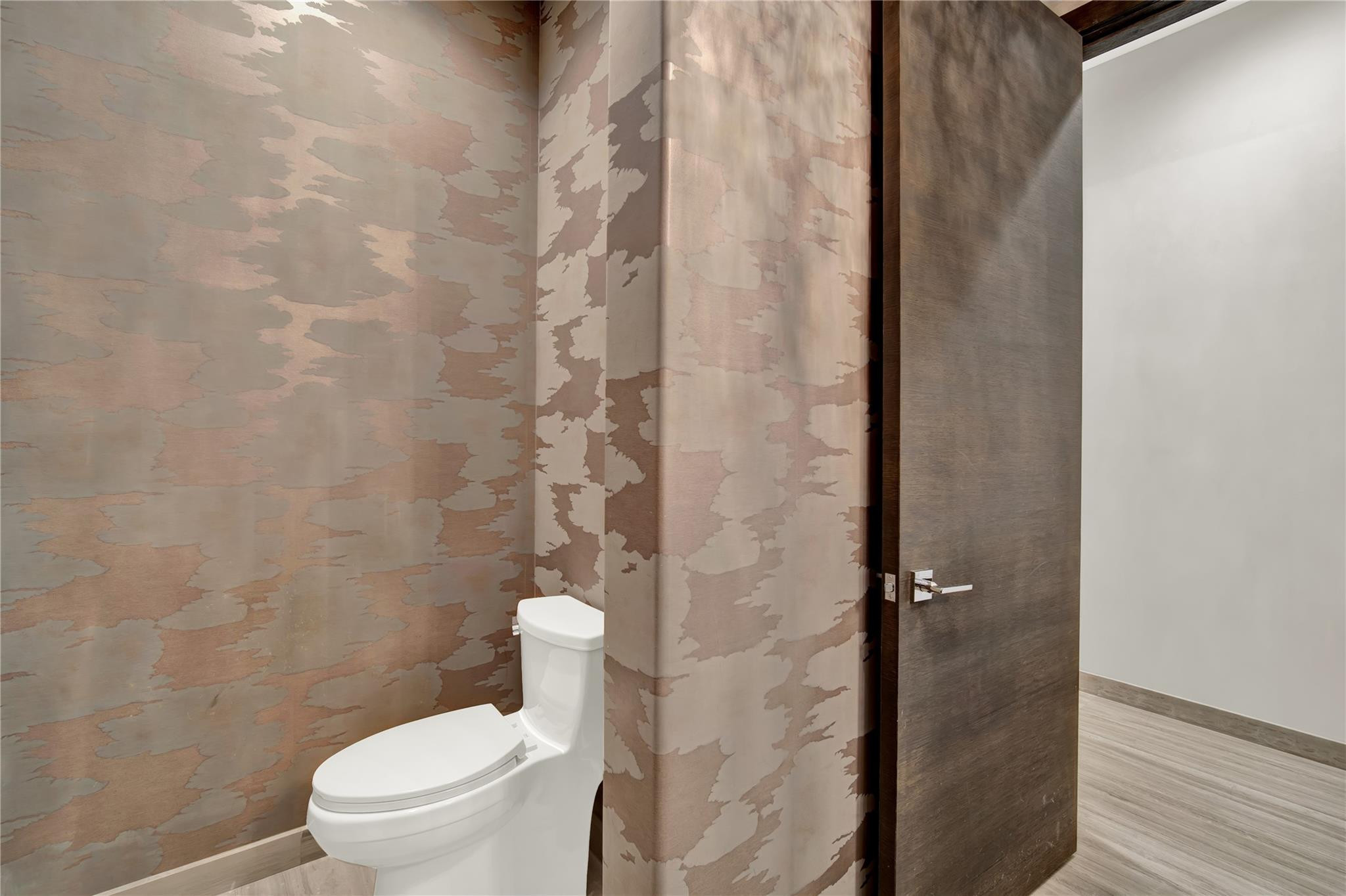 425 North Ocean Boulevard, Unit 3 Boca Raton, FL 33432 - Photo 40 of 69 a white toilet sitting next to a shower curtain