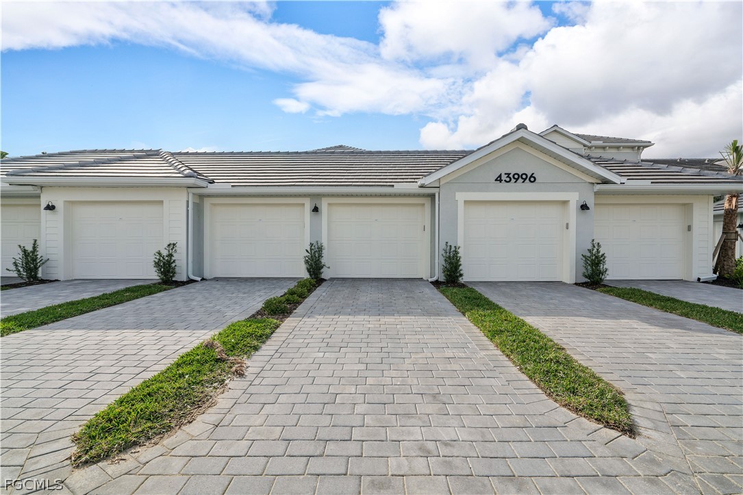 43996 Boardwalk Loop, Unit 1422 Punta Gorda, FL 33982 - Photo 1 of 37 a view of a front door and a yard