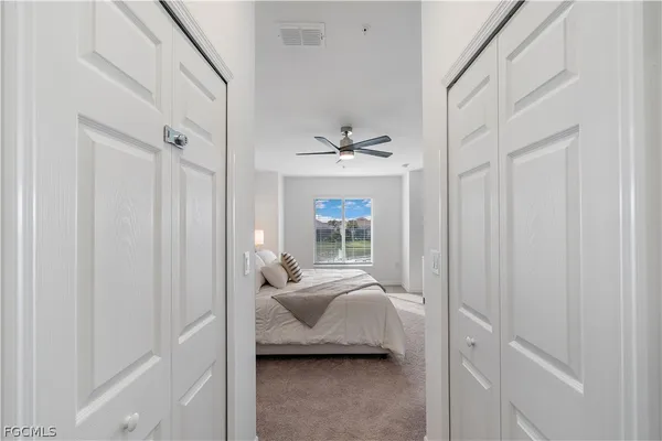 a bedroom with furniture and a window