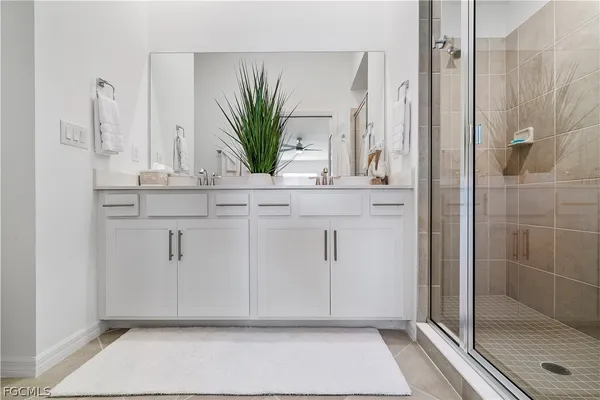 a bathroom with a shower and a sink