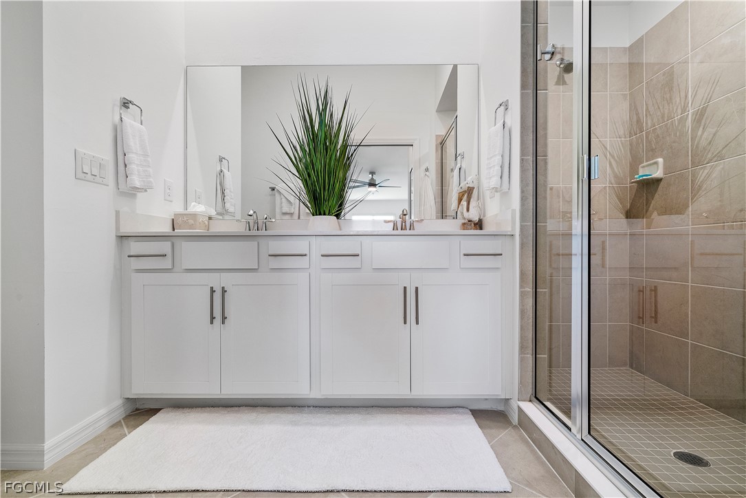 43996 Boardwalk Loop, Unit 1422 Punta Gorda, FL 33982 - Photo 18 of 37 a bathroom with a shower and a sink