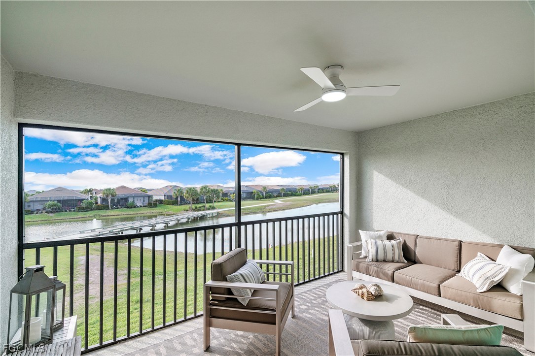 43996 Boardwalk Loop, Unit 1422 Punta Gorda, FL 33982 - Photo 22 of 37 a living room with furniture and a floor to ceiling window