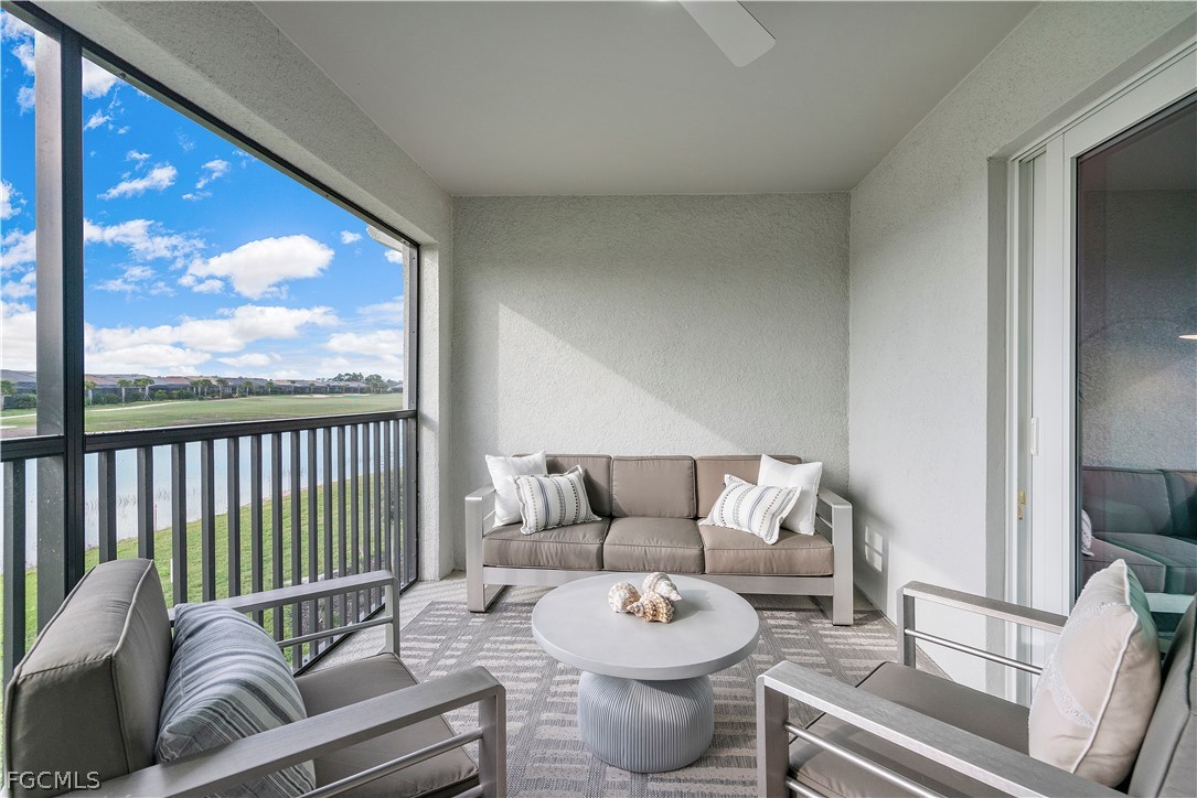 43996 Boardwalk Loop, Unit 1422 Punta Gorda, FL 33982 - Photo 24 of 37 a living room with furniture and a large window