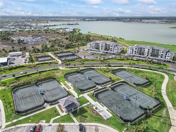 an aerial view of a house with a lake view
