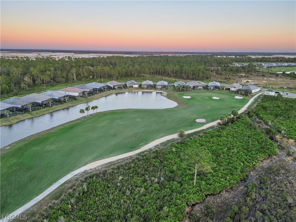 43996 Boardwalk Loop, Unit 1422 Punta Gorda, FL 33982 - Photo 33 of 37 a view of a city with a yard