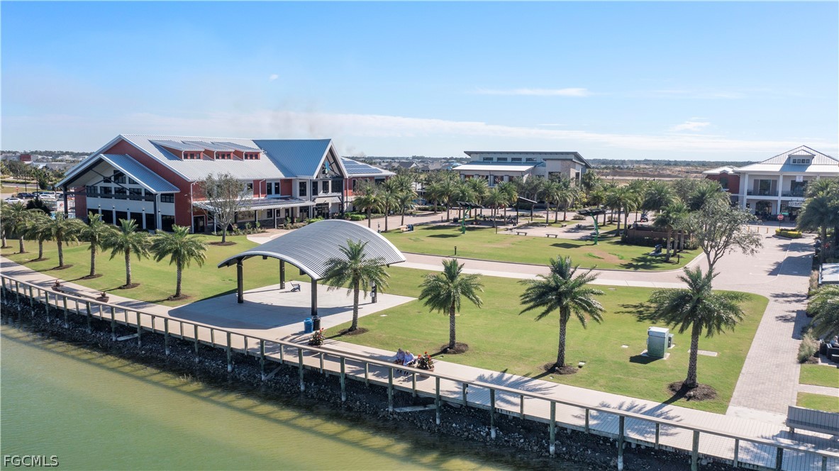 43996 Boardwalk Loop, Unit 1422 Punta Gorda, FL 33982 - Photo 35 of 37 a swimming pool with outdoor seating and city view