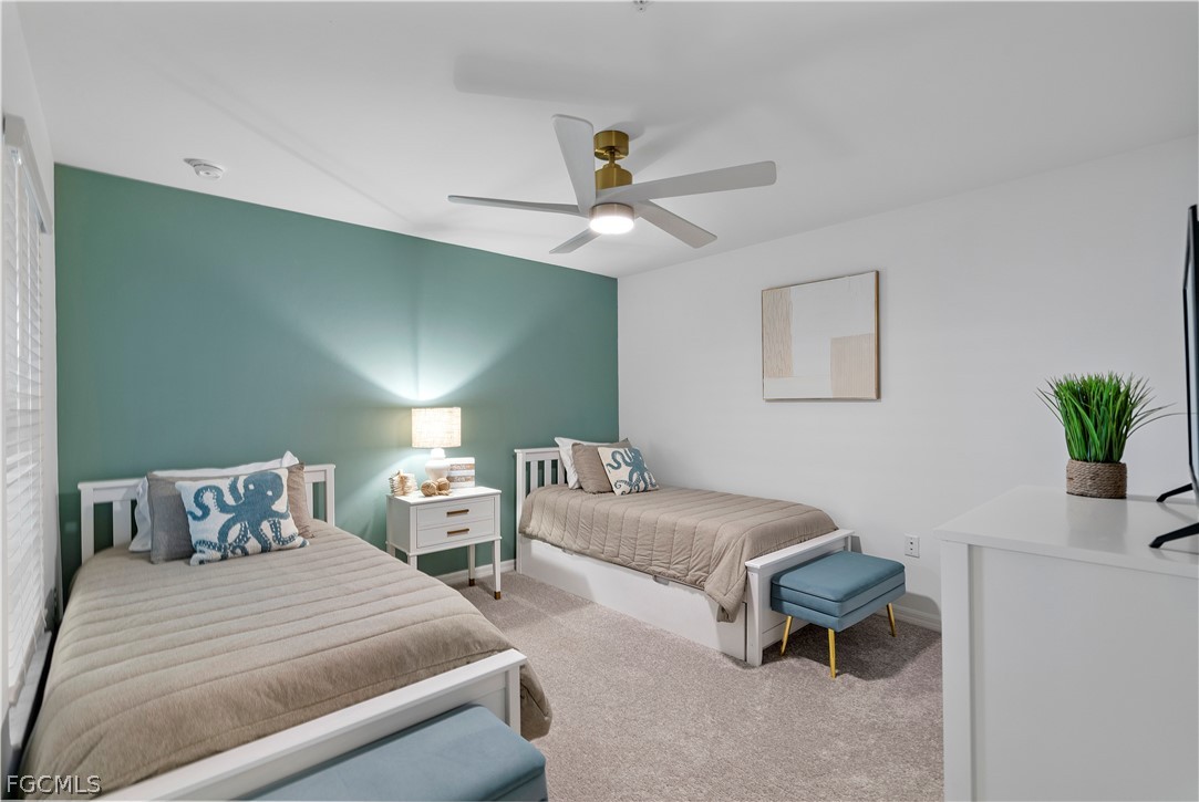 43996 Boardwalk Loop, Unit 1422 Punta Gorda, FL 33982 - Photo 5 of 37 a bedroom with two beds and a potted plant