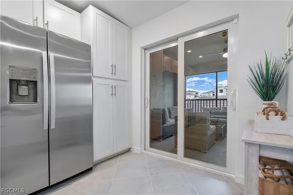 a bathroom with a glass shower door and a sink