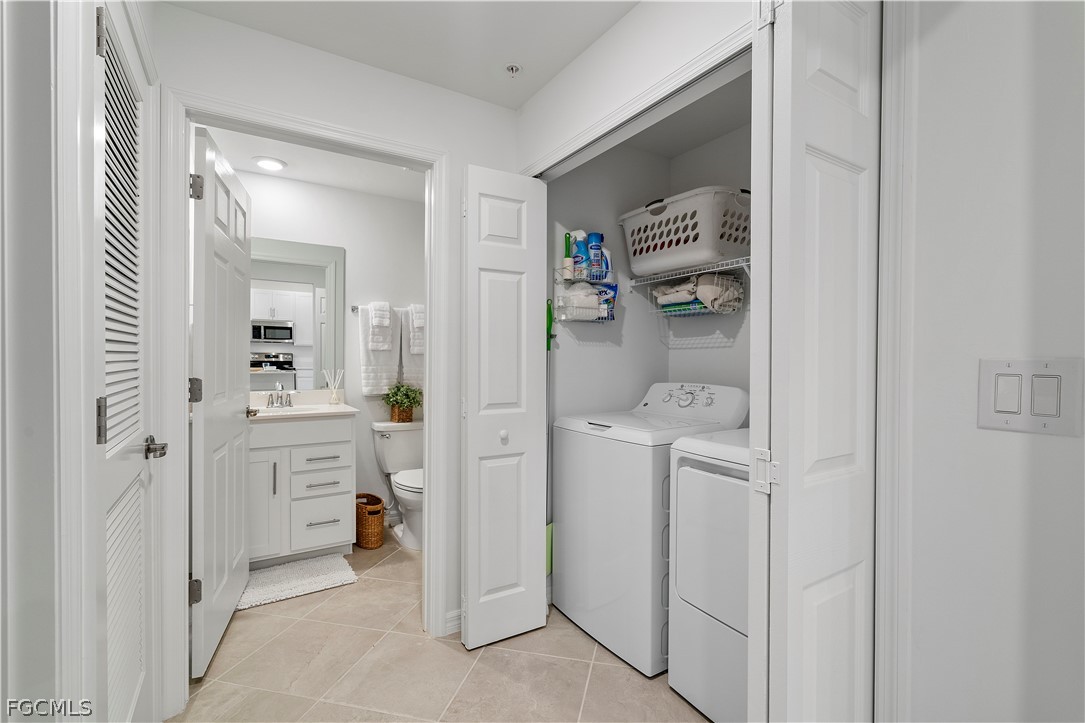 43996 Boardwalk Loop, Unit 1422 Punta Gorda, FL 33982 - Photo 10 of 37 a room with white cabinets and sink