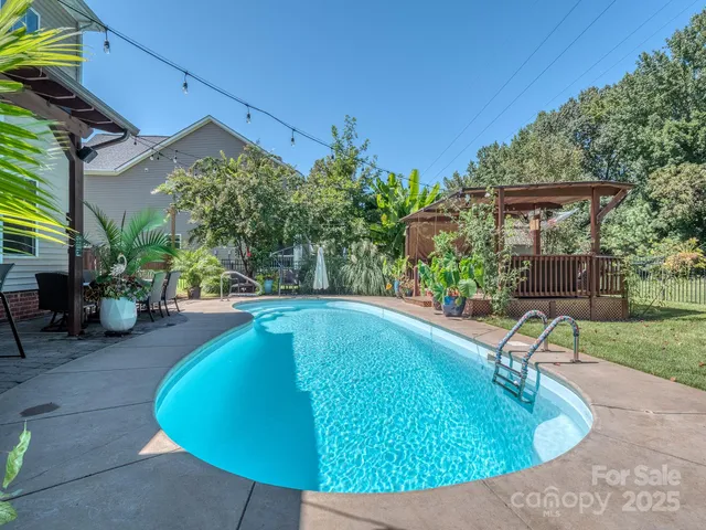 a view of a patio with a table chairs and a patio