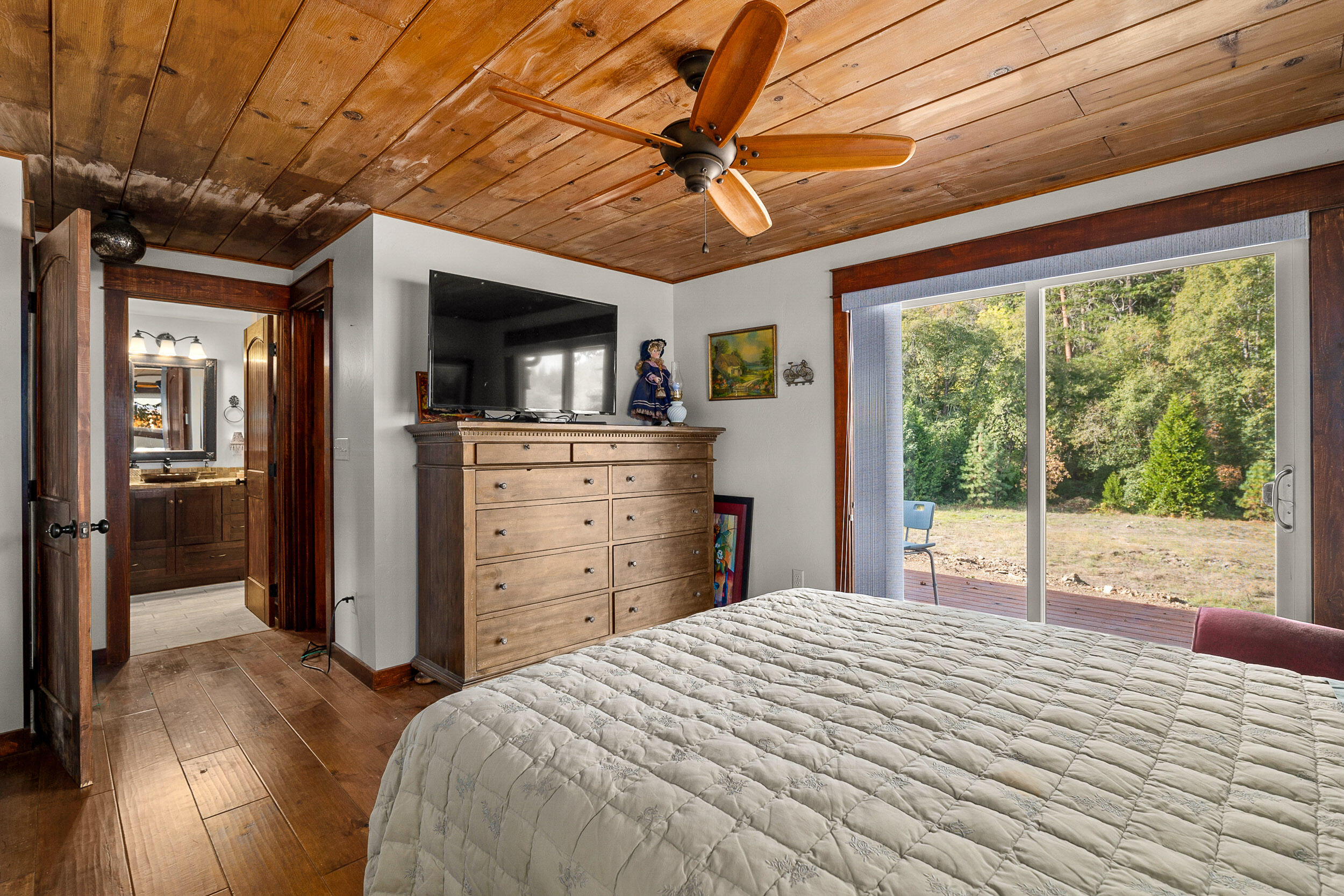 3732-3786 Little Applegate Road Jacksonville, OR 97530 - Photo 16 of 72 a bedroom with a bed and a television