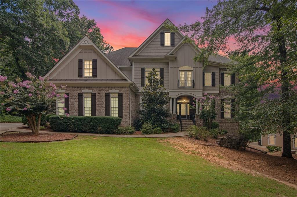 5053 Chapel Crossing Road Douglasville, GA 30135 - Photo 1 of 94 a front view of a house with a yard