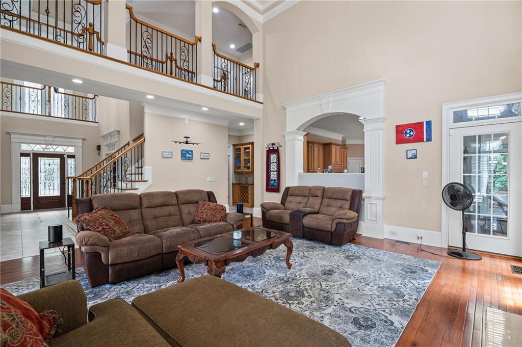5053 Chapel Crossing Road Douglasville, GA 30135 - Photo 14 of 94 a living room with furniture and a wooden floor