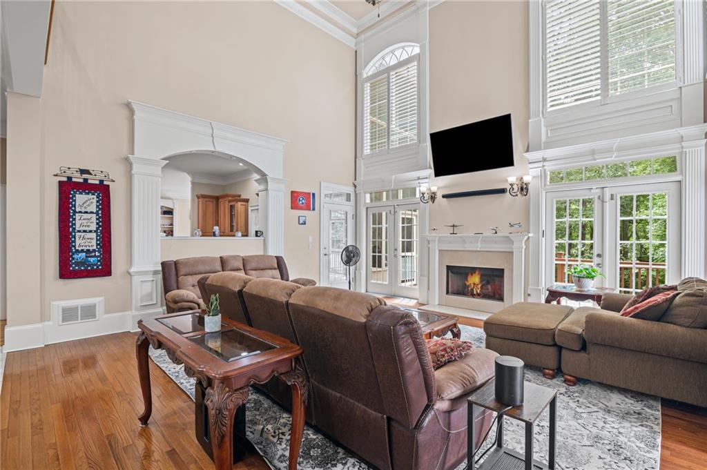 5053 Chapel Crossing Road Douglasville, GA 30135 - Photo 15 of 94 a living room with furniture a fireplace and a flat screen tv