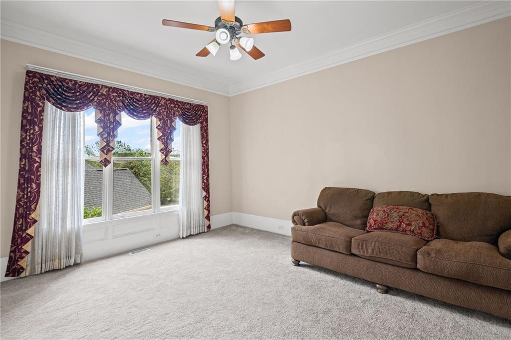 5053 Chapel Crossing Road Douglasville, GA 30135 - Photo 18 of 94 a living room with furniture and a large window